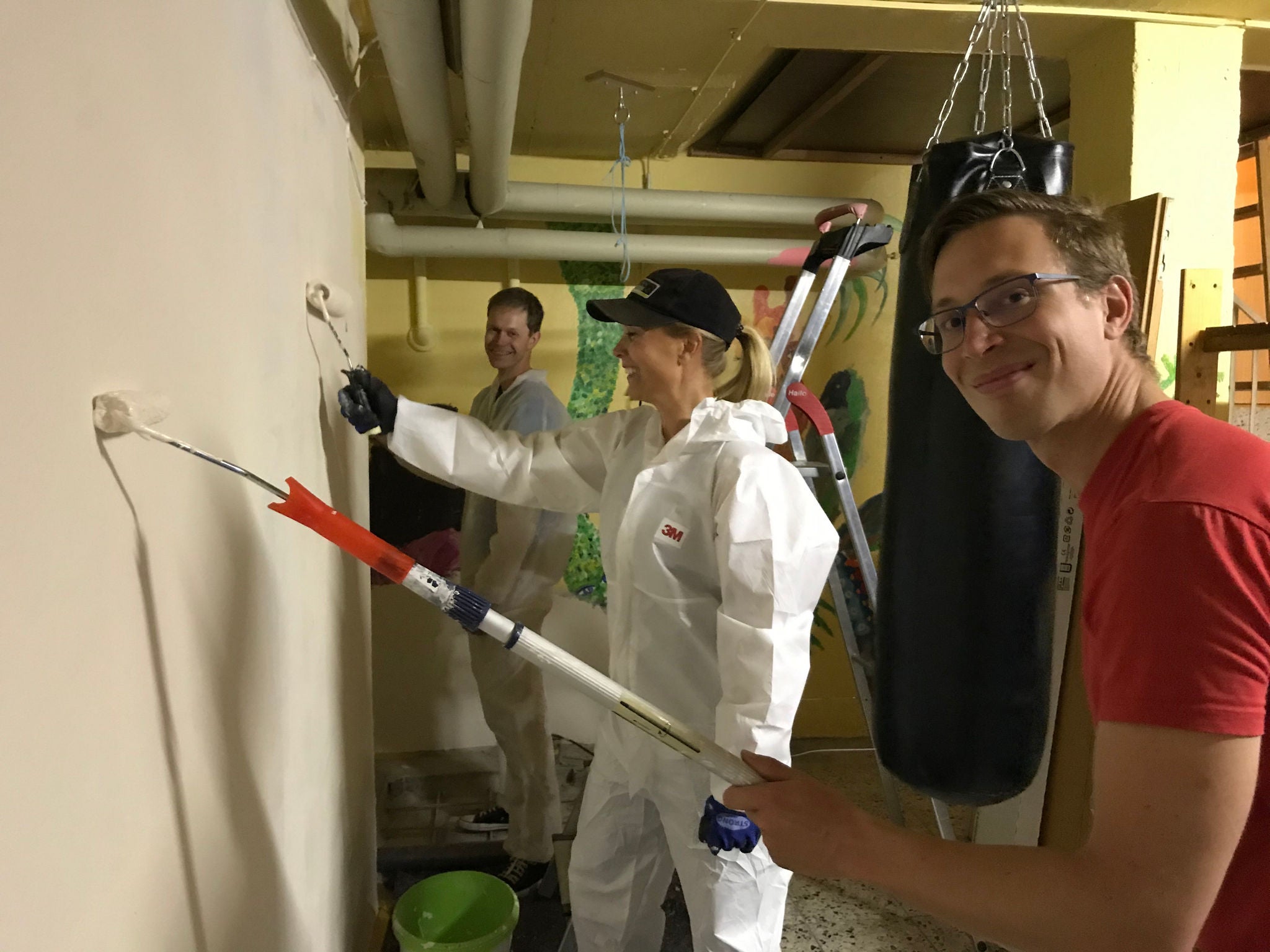 Employees of NORMA Group painting.